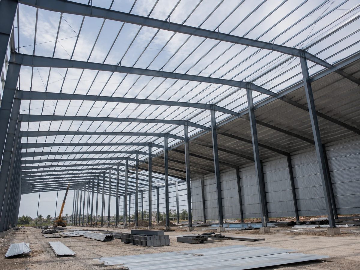 Steel portal frame shed under erection with cladding going on